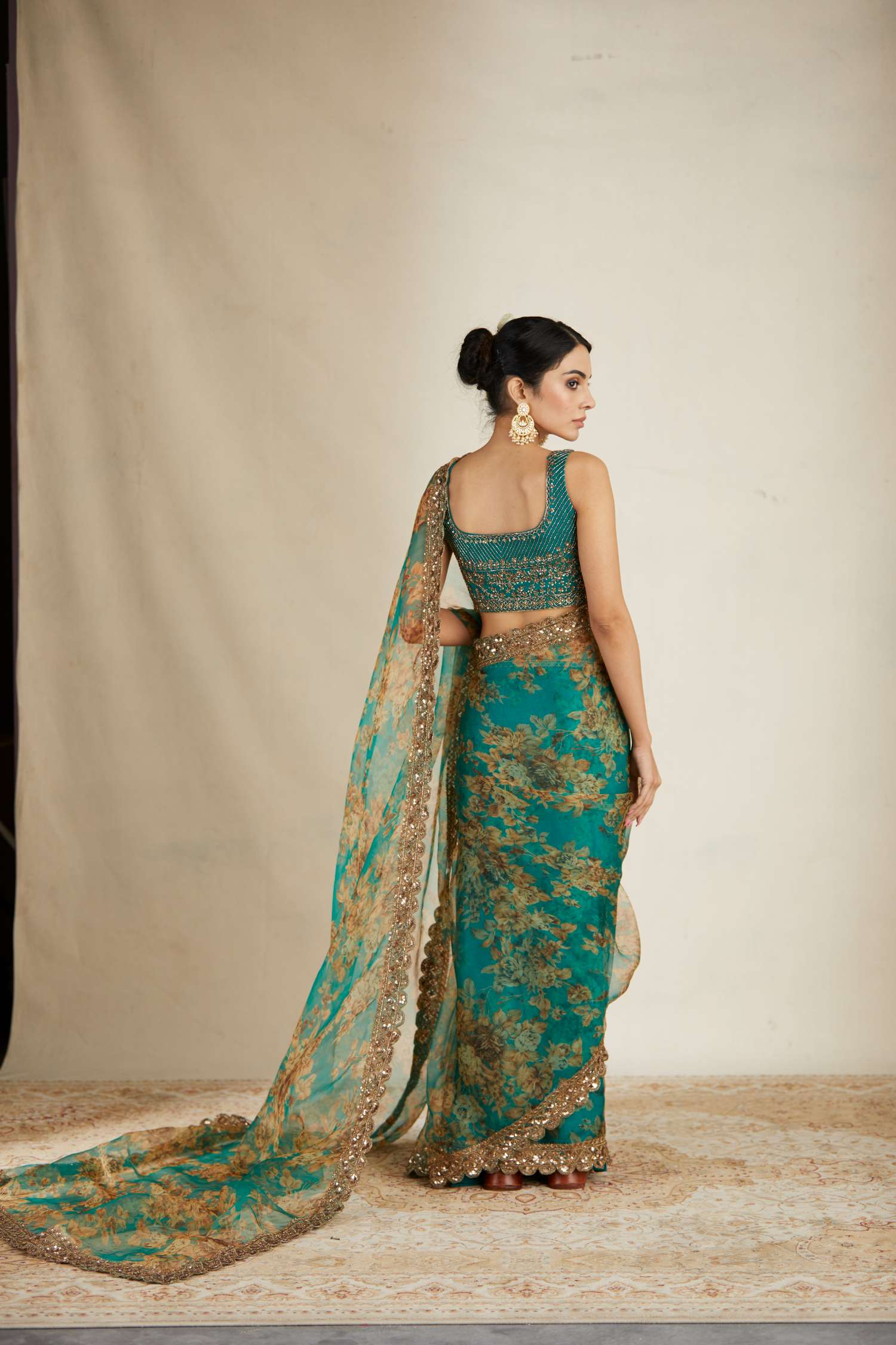 Side view of Teal Green Floral Organza Saree Set for Women