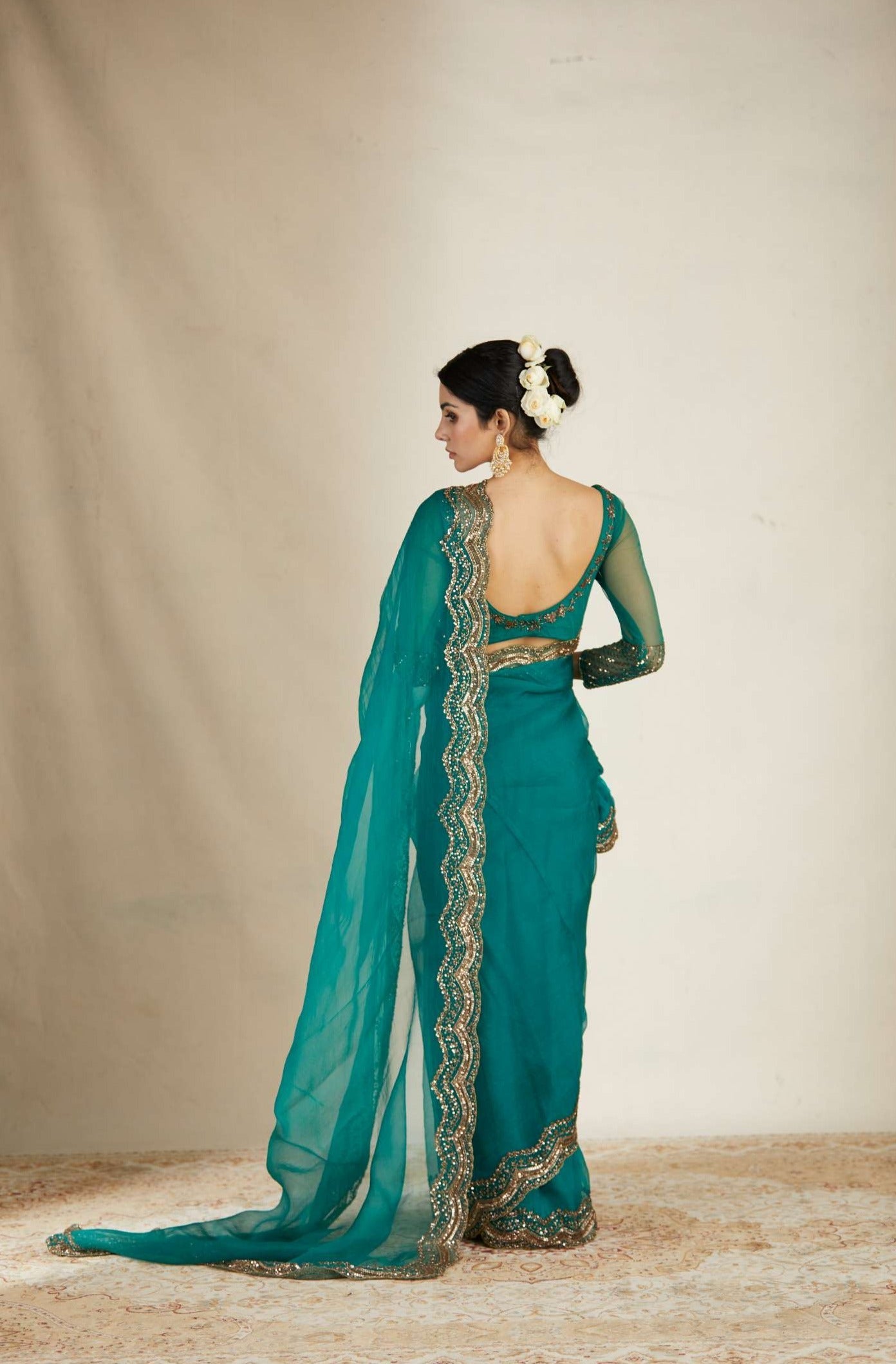 Back Angle view of Teal Green Organza Sequence Work Saree Set