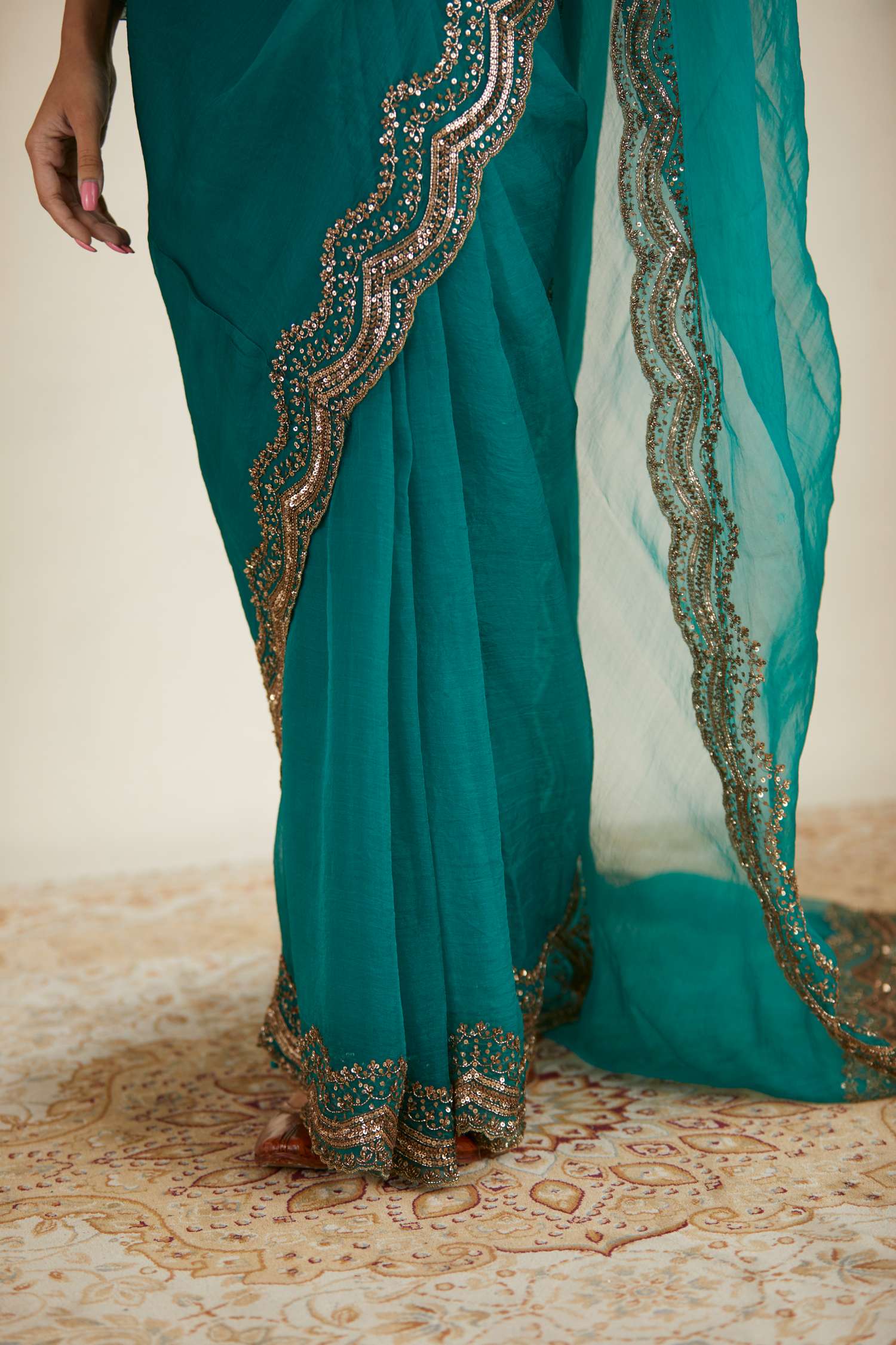 Close-up of Teal Green Organza Sequence Work Saree