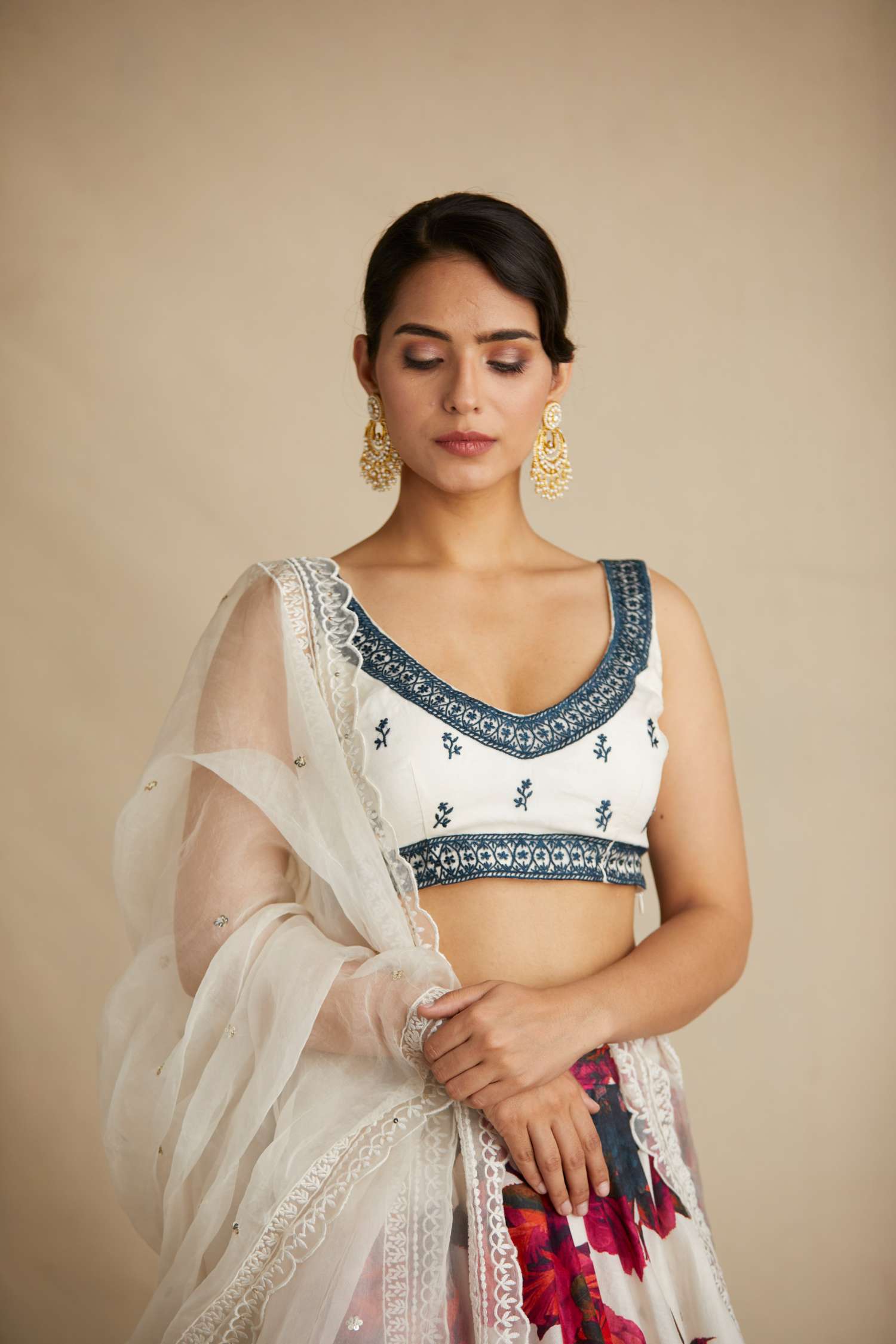 Close-up of White Red Floral Chanderi Lehenga Set