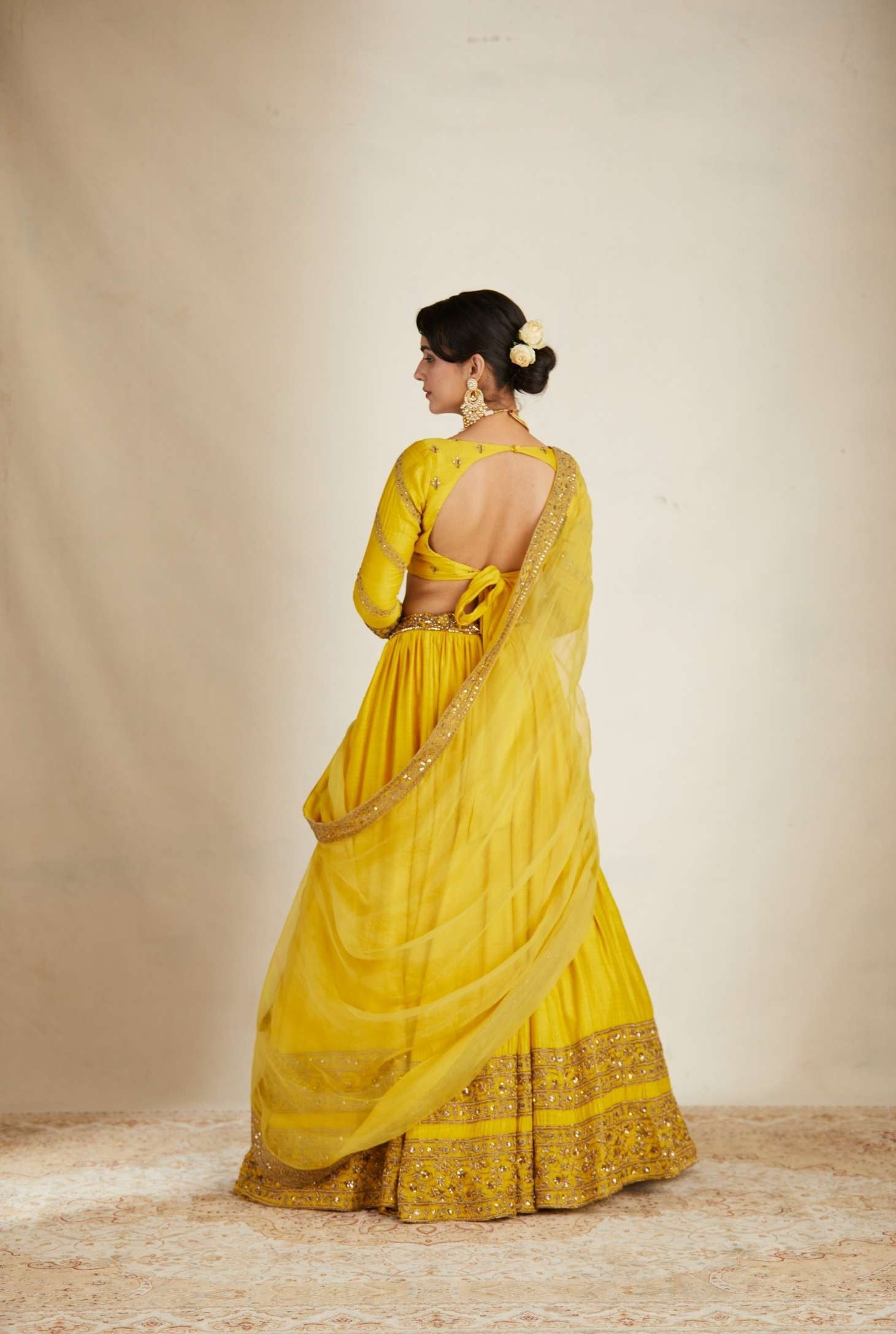 Back Angle view of Mustard Chanderi Silk Crepe Bead Embroidered Lehenga Set