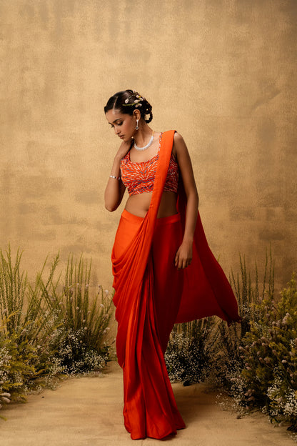 Bright Orange pre-draped modal satin saree with embroidered blouse