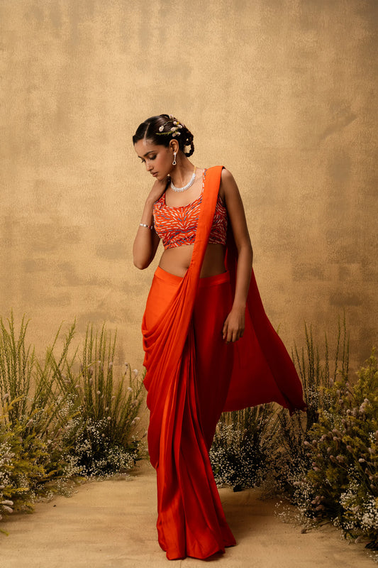 Bright Orange pre-draped modal satin saree with embroidered blouse