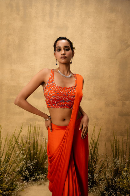 Bright Orange pre-draped modal satin saree with embroidered blouse