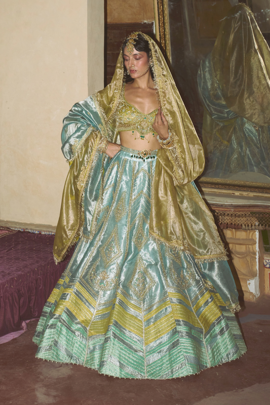 Ice blue silk zari tissue lehenga with olive bloom dupatta