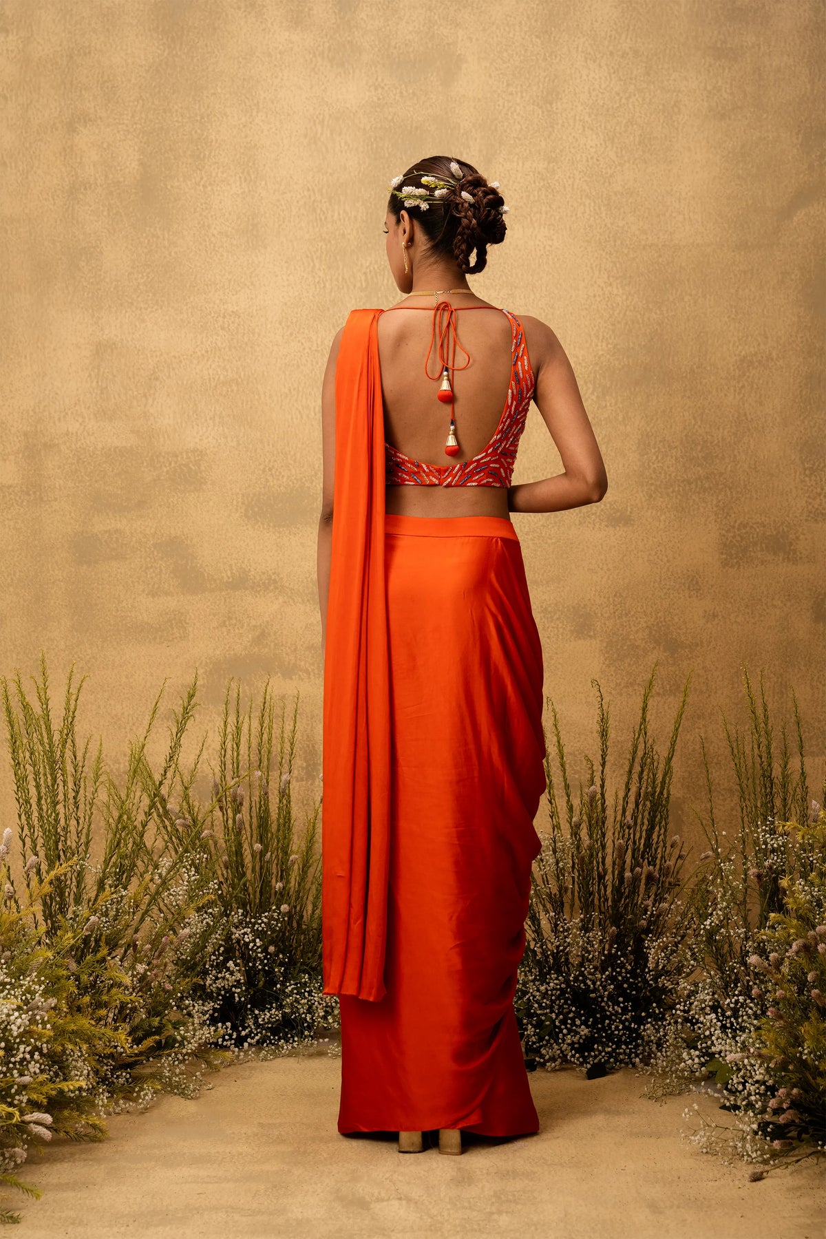 Bright Orange pre-draped modal satin saree with embroidered blouse