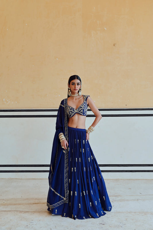 ROYAL BLUE DEEP NECKLINE EMBROIDERED SLEEVELESS BLOUSE WITH FLORAL BUTTI EMBROIDERED LEHENGA AND DUPATTA- EC-LH-RAHI25-25- RoyalBlue