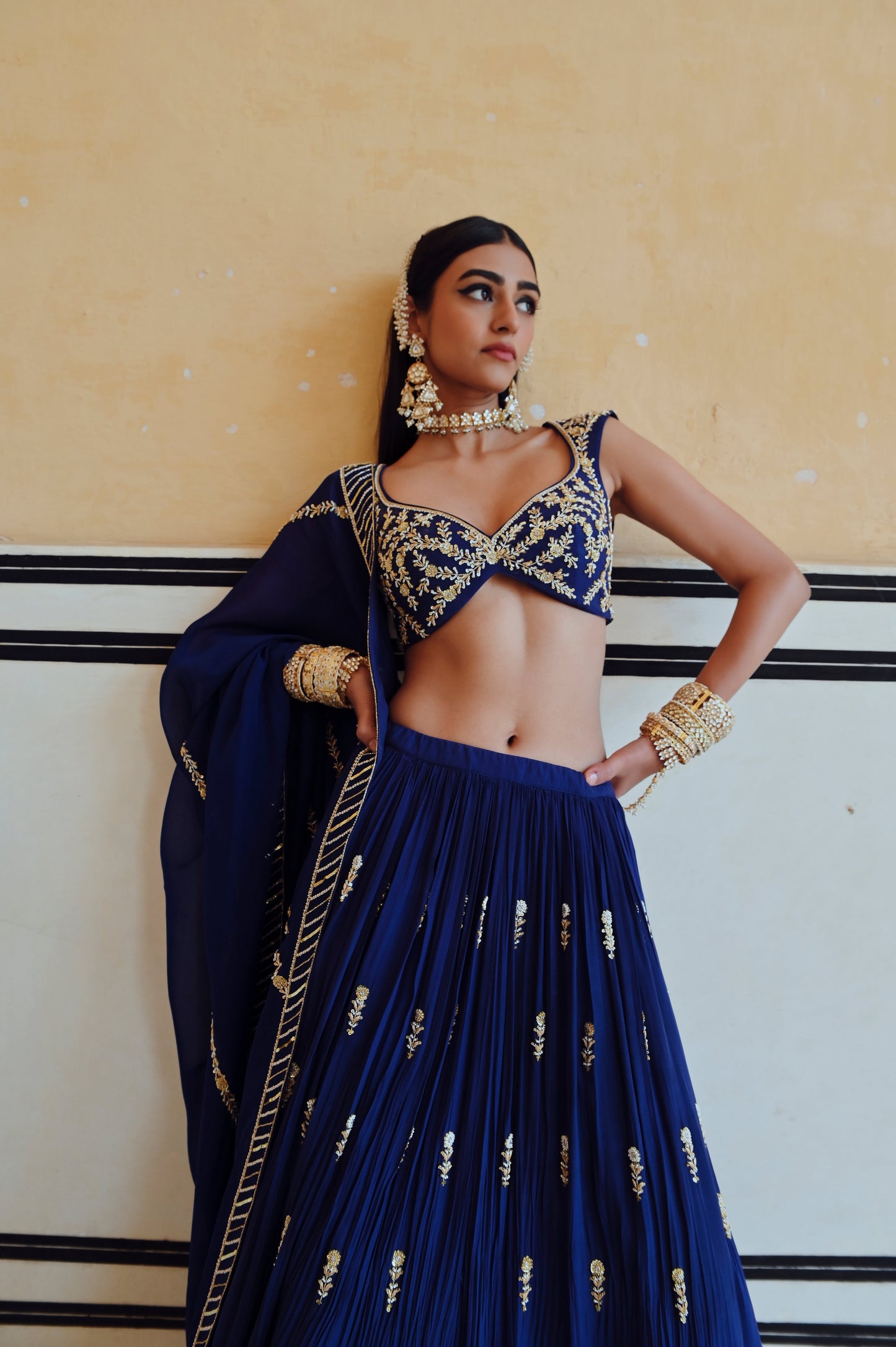 ROYAL BLUE DEEP NECKLINE EMBROIDERED SLEEVELESS BLOUSE WITH FLORAL BUTTI EMBROIDERED LEHENGA AND DUPATTA- EC-LH-RAHI25-25- RoyalBlue