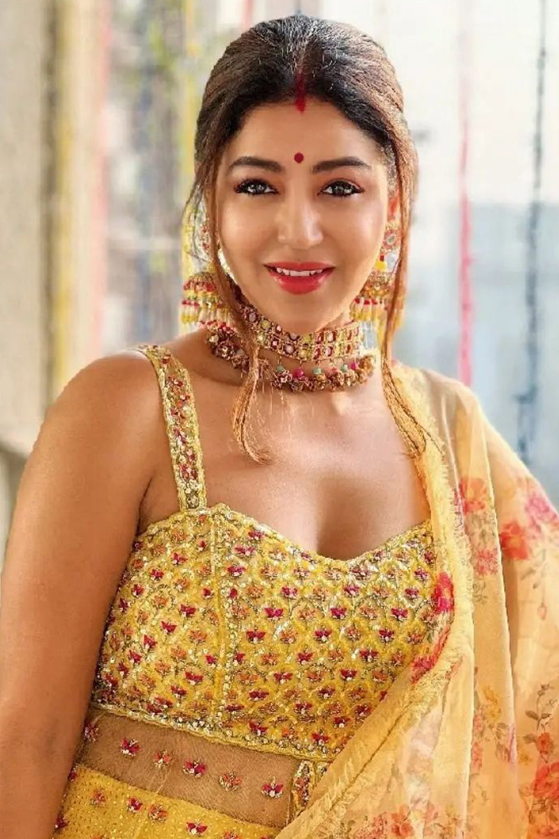 Devoleena in Bright Yellow Net Peplum With Georgette Mokaish Lehenga