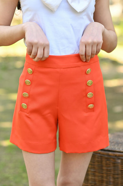 WHITE BOW TOP & ORANGE SHORTS SET