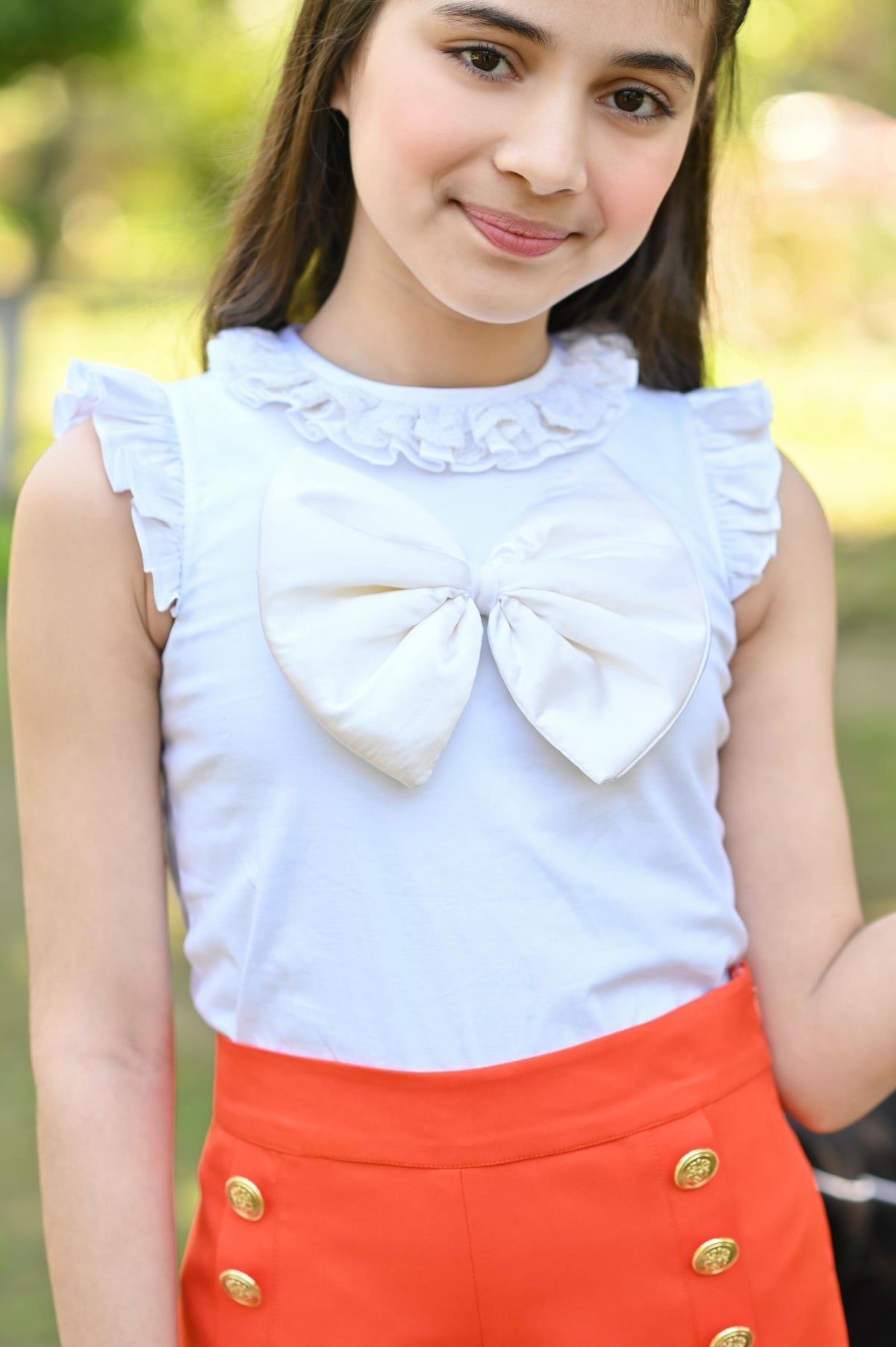 WHITE BOW TOP & ORANGE SHORTS SET