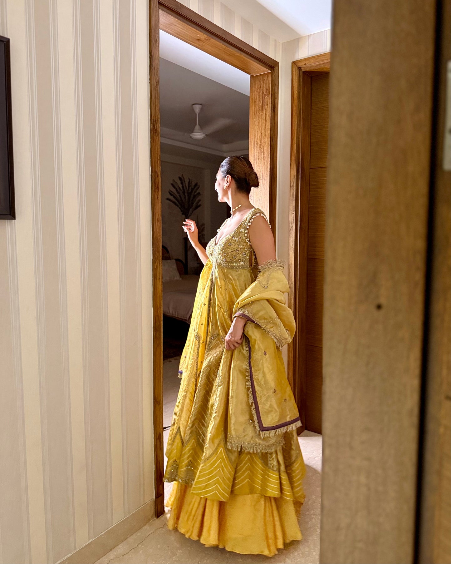 Sukhneet Wadhwa in our Mustard yellow zari tissue jacket with crushed skirt set