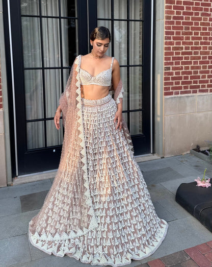 BHAVDEEP KAUR In Deep Beige Chandelier Pearl Drop Lehenga Set