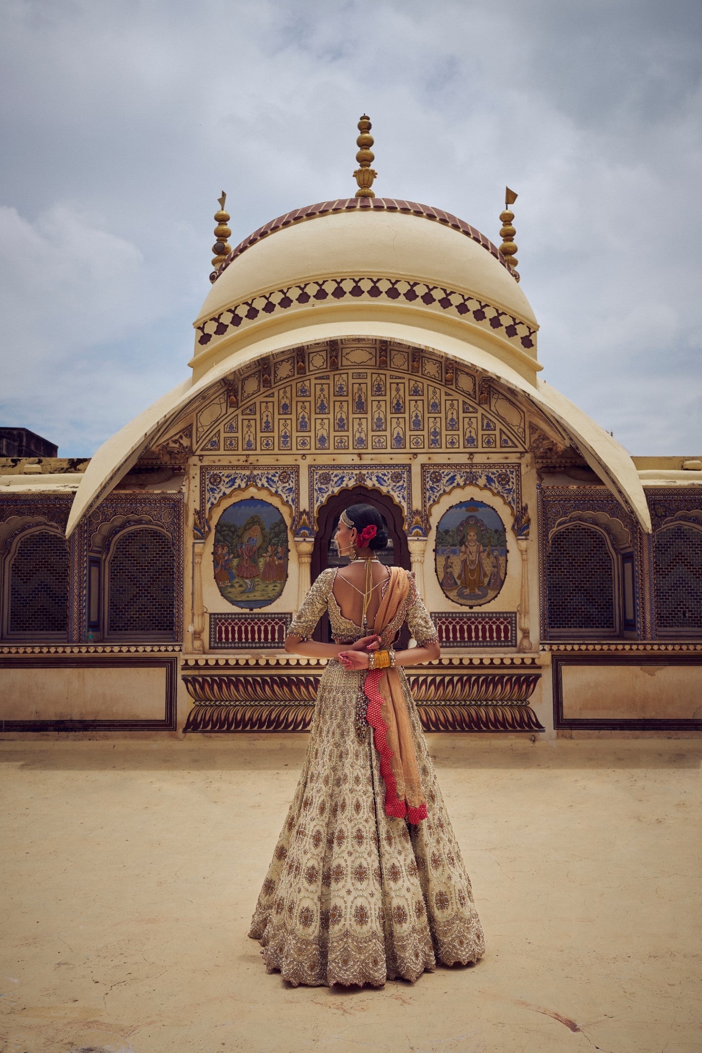 GOLD TISSUE LEHENGA CHOLI WITH A PEACH TISSUE  DUPATTA