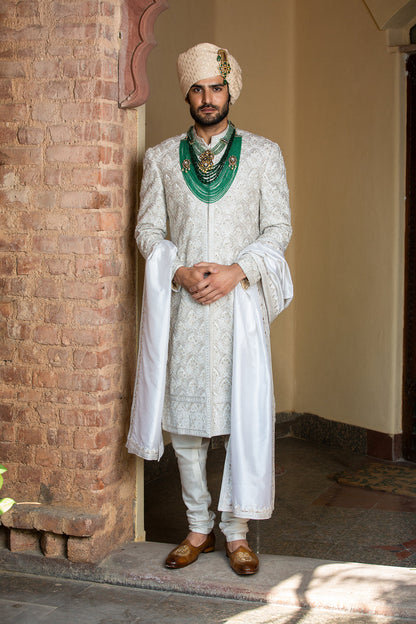 Ivory Taffeta Achkan and Belt all over Embroidered with Monga Kurta and Churidar