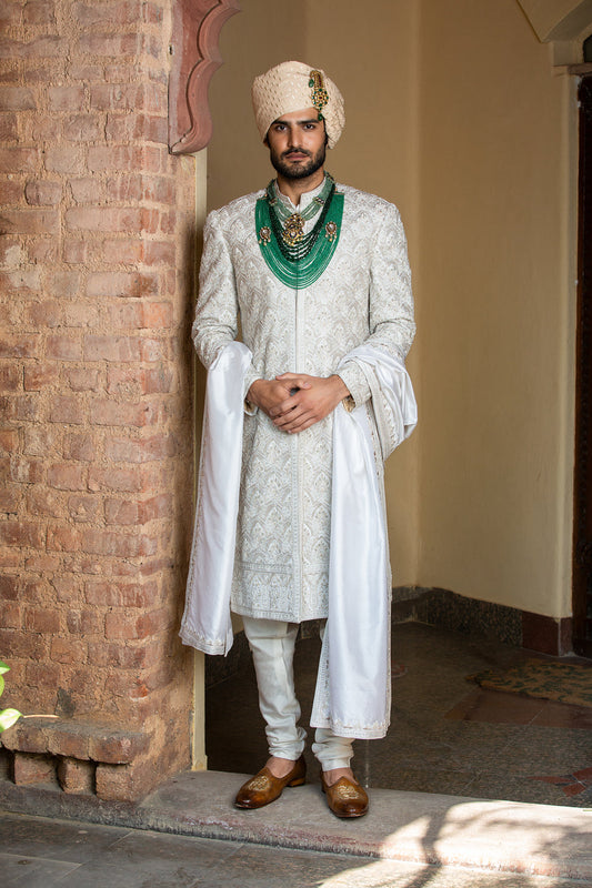 Ivory Taffeta Achkan and Belt all over Embroidered with Monga Kurta and Churidar