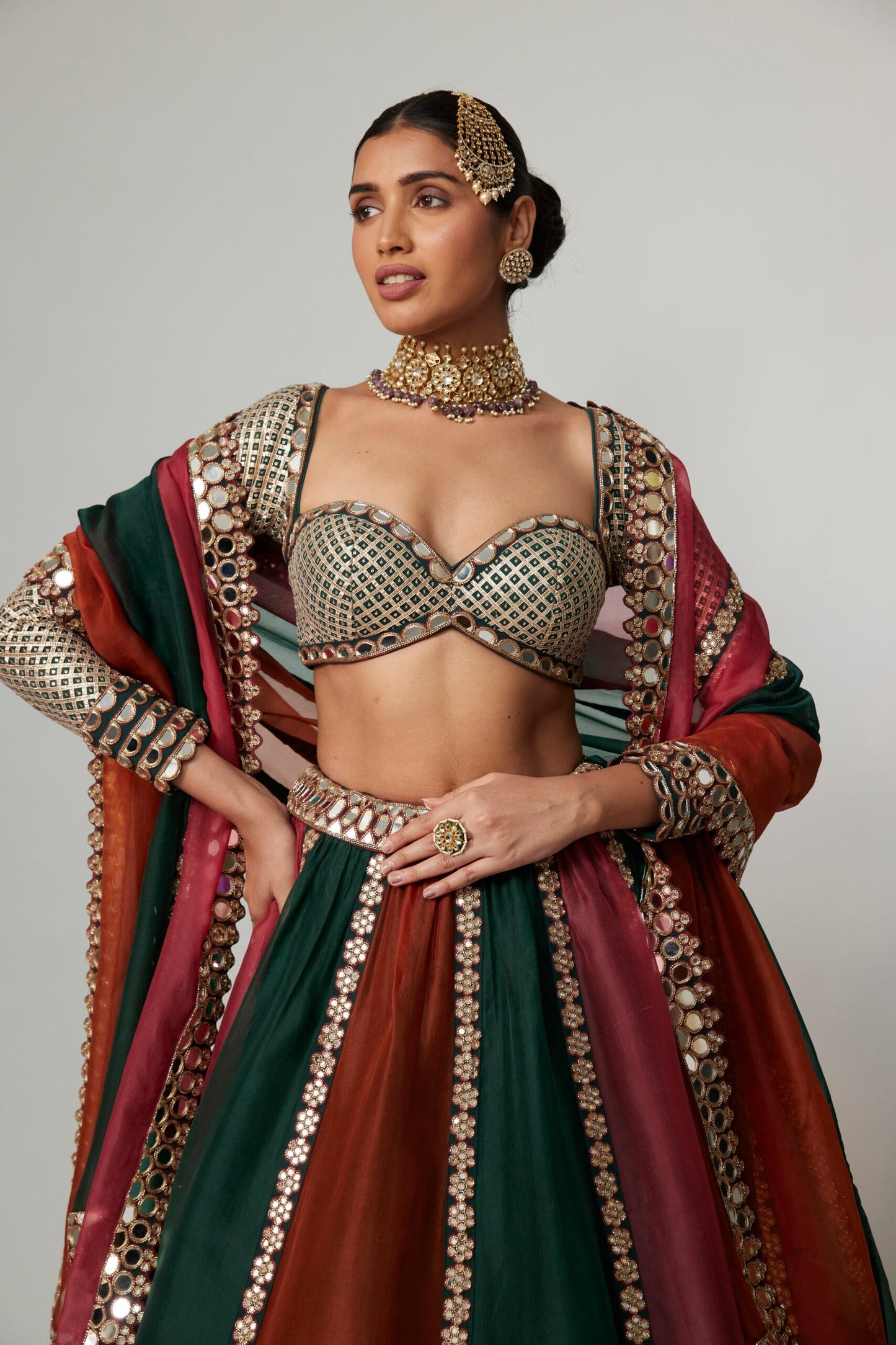 CRANBERRY MULTICOLOR LINEAR LEHENGA WITH SWEETHEART FULL SLEEVE BLOUSE.