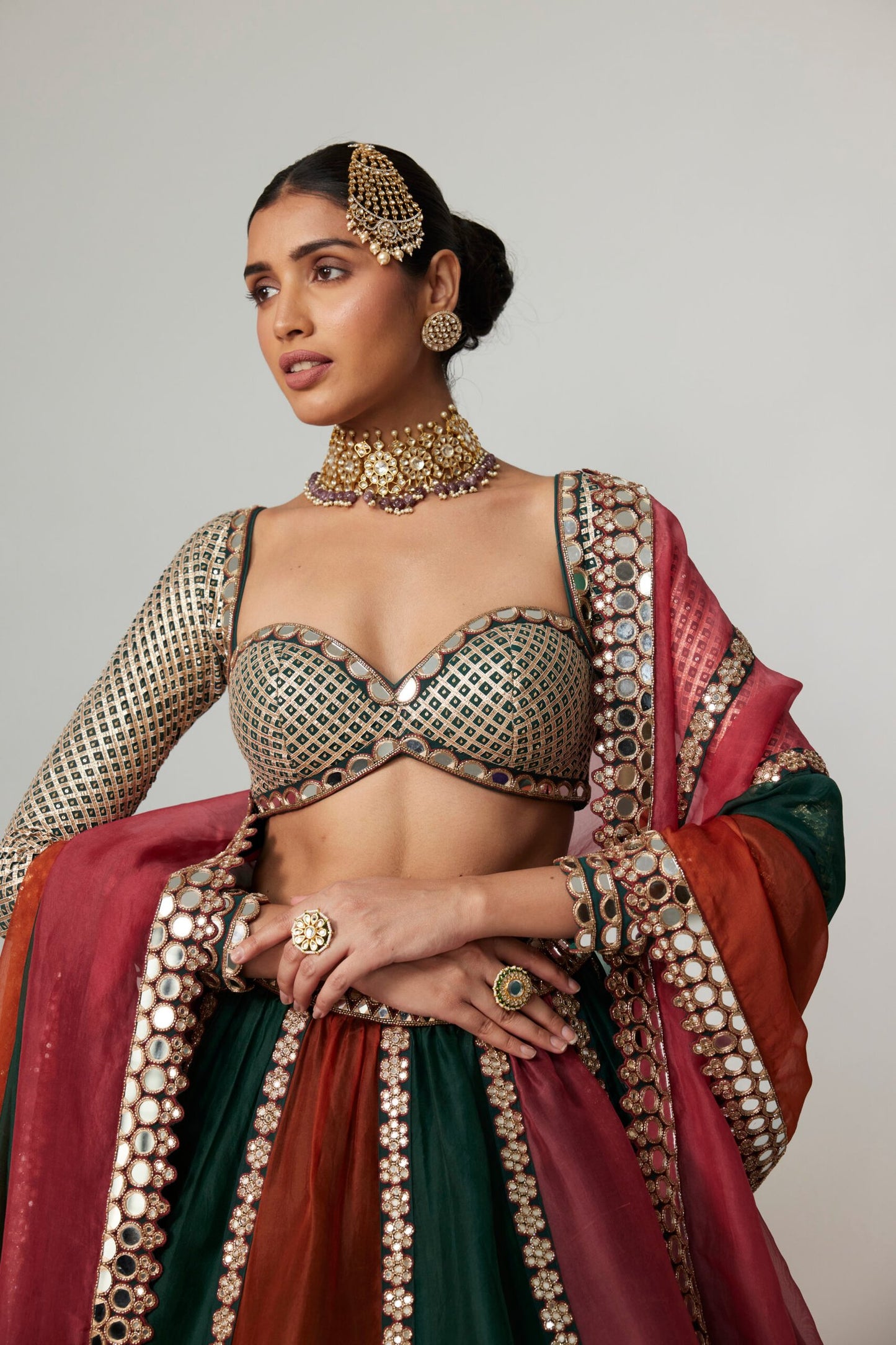 CRANBERRY MULTICOLOR LINEAR LEHENGA WITH SWEETHEART FULL SLEEVE BLOUSE.