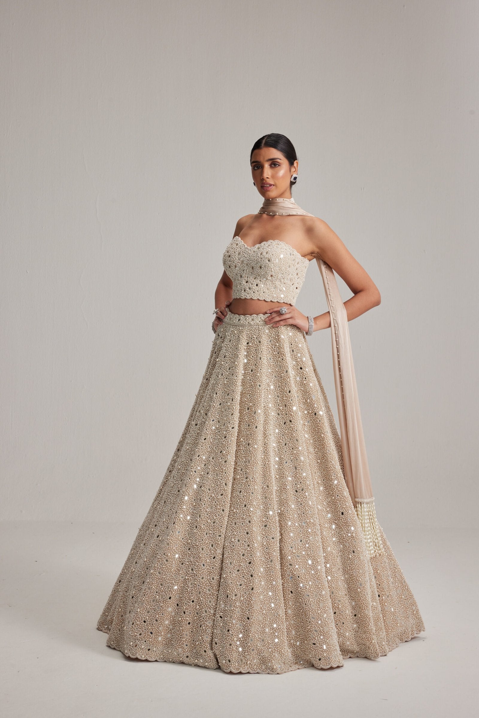 Light Beige Dense mirror and pearl Corset lehenga set With Stole