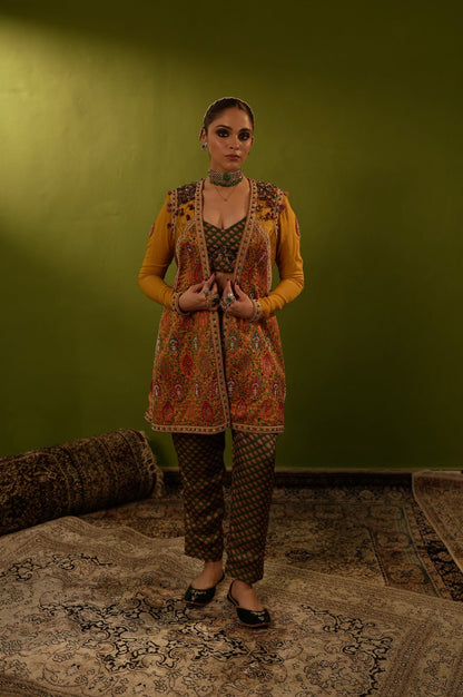 Green pants with blouse and mustard yellow jamawar jacket
