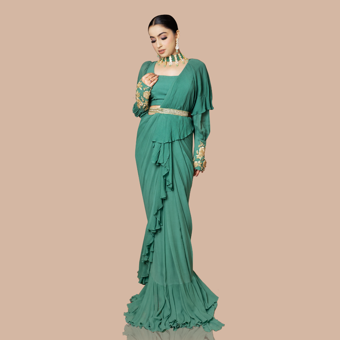 Turquoise blue drape saree with ruffles paired with blouse and waist belt
